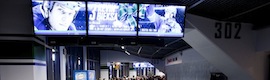 Vancouver Canucks fans cheer on their hockey team in 450 screens with Harris Infocaster 