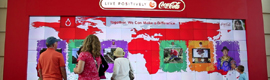 An interactive video wall, that detects movement, attracts visitors to the World of Coca-Cola museum