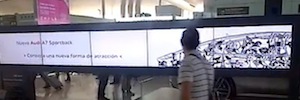 An interactive videowall creates a 'magnetic attraction' between the passengers of El Prat and the new Audi A7 Sportback