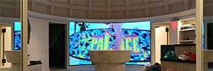 A curved Led screen wraps skateboard fans in the new Palace Skateboards store